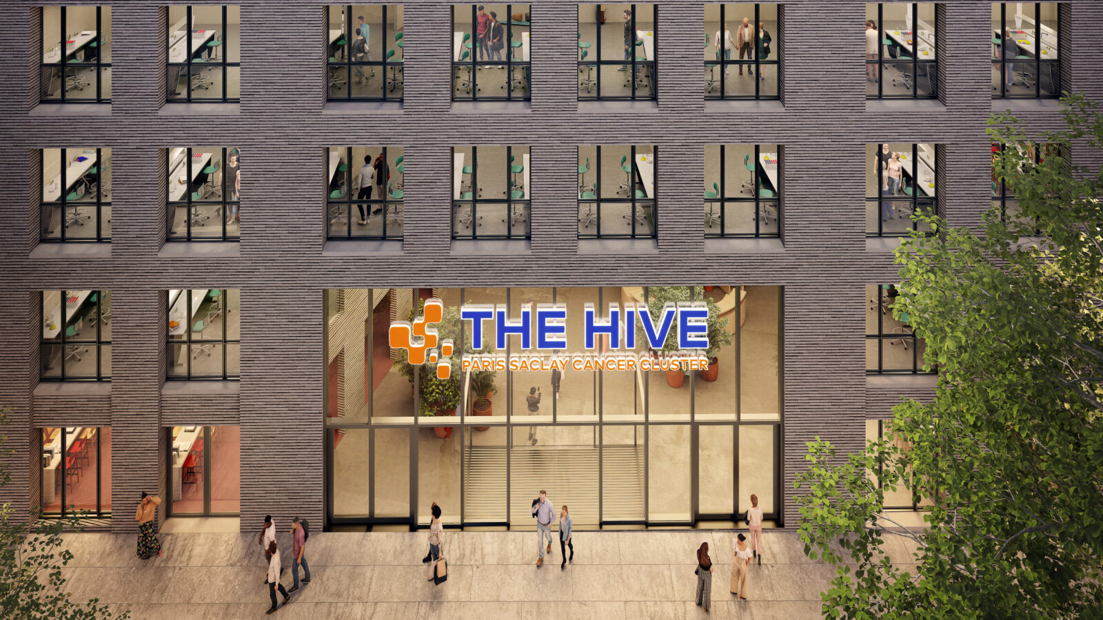 A close-up of the entrance of The Hive at Cancer Cluster Villejuif, showing lit up office spaces